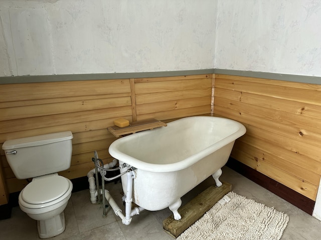 bathroom featuring a bathing tub and toilet