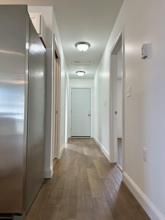 corridor featuring hardwood / wood-style floors