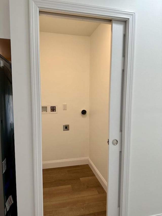 laundry area featuring electric dryer hookup, hookup for a washing machine, and hardwood / wood-style floors