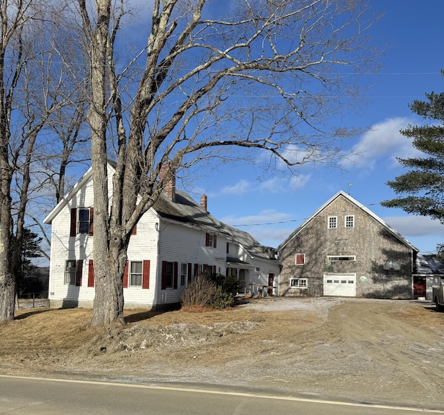 view of side of home with a garage