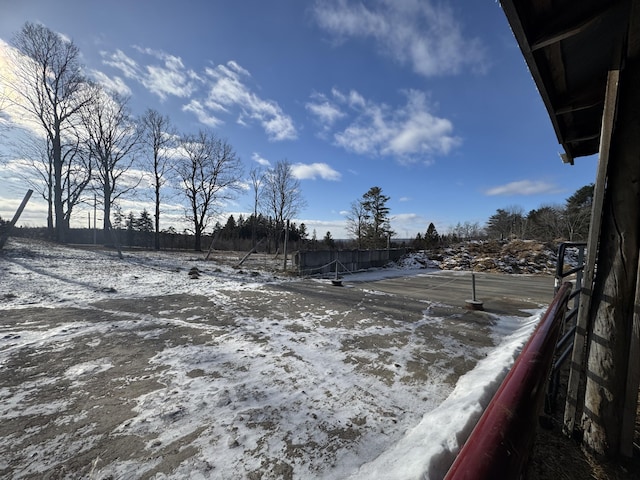 view of yard layered in snow