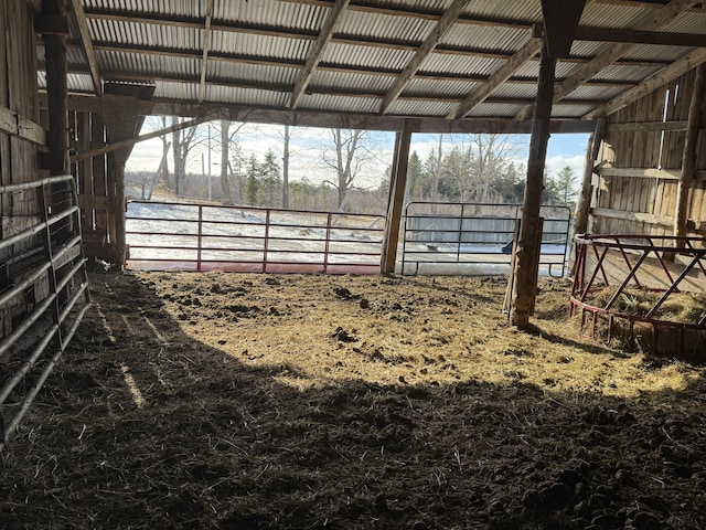 view of horse barn with a water view