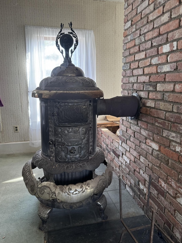 room details with a wood stove and carpet