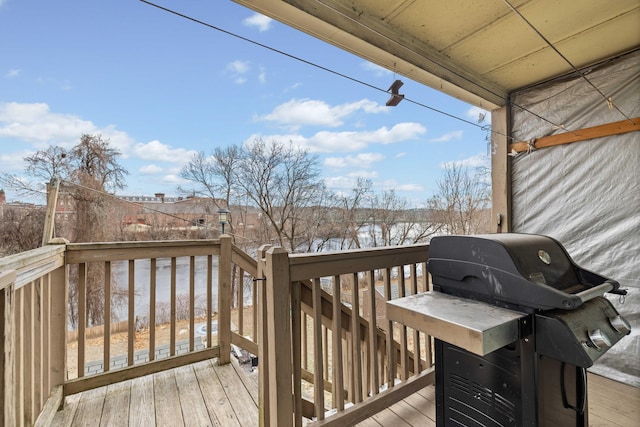 wooden terrace with area for grilling