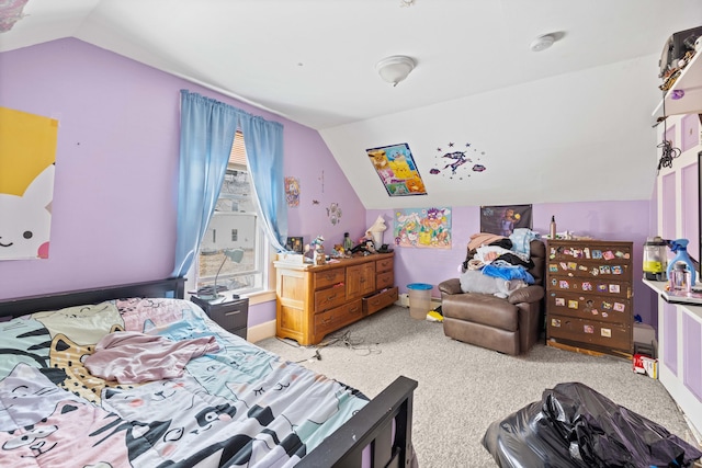 bedroom featuring carpet floors and lofted ceiling