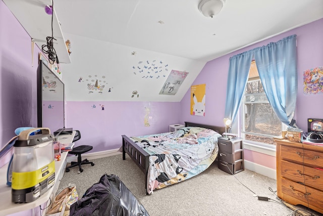 carpeted bedroom with lofted ceiling