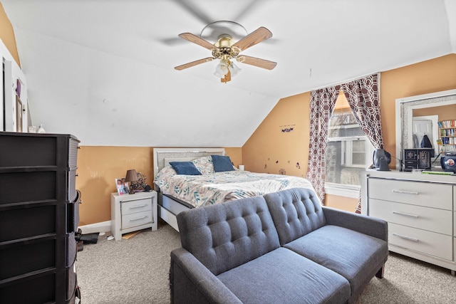 bedroom featuring carpet, ceiling fan, and vaulted ceiling