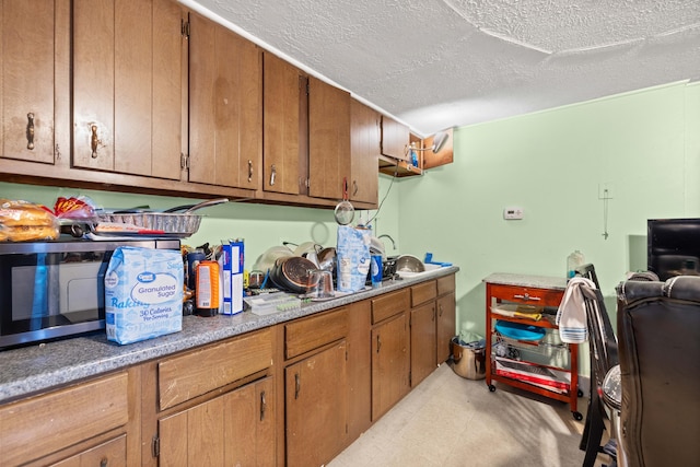 laundry room featuring a textured ceiling