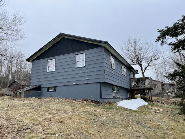 view of side of property with a deck