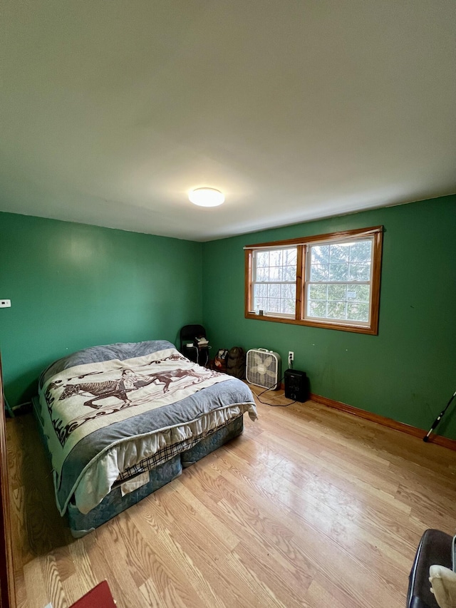 bedroom with light hardwood / wood-style floors