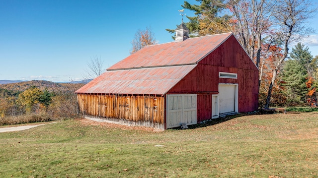 view of outbuilding with a yard