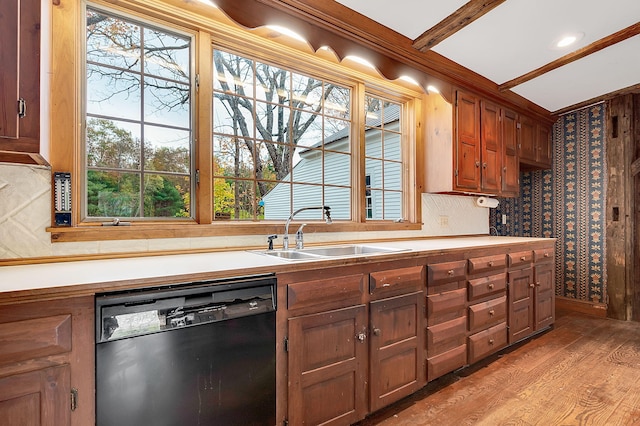 kitchen with a healthy amount of sunlight, dishwasher, light hardwood / wood-style floors, and sink