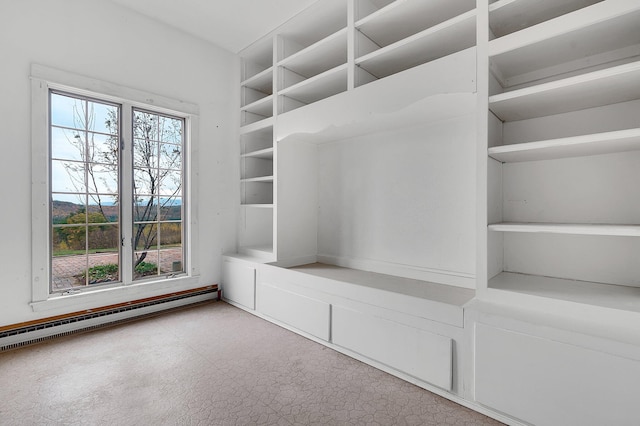 spacious closet with baseboard heating