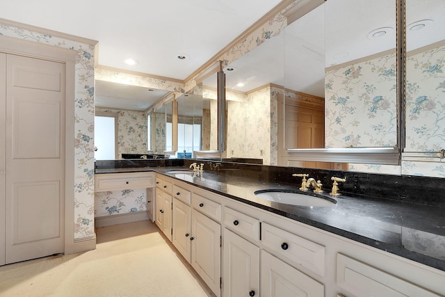 bathroom featuring vanity and ornamental molding