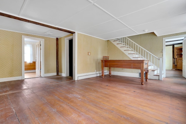 interior space with wood-type flooring and a baseboard radiator