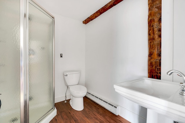 bathroom with an enclosed shower, a baseboard heating unit, sink, hardwood / wood-style flooring, and toilet