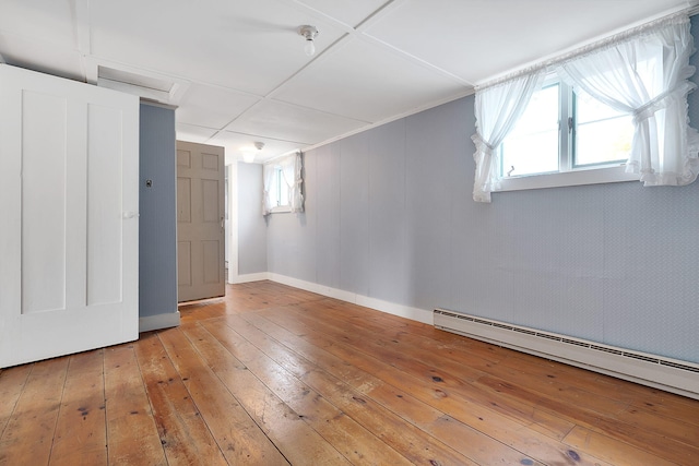 interior space featuring hardwood / wood-style floors and a baseboard radiator