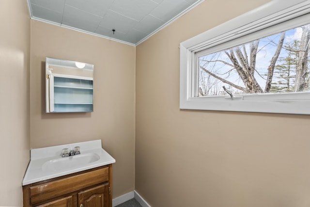 bathroom featuring vanity and ornamental molding