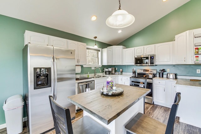 433 Works Rd, Jackson, ME 04921 - kitchen with appliances with stainless steel finishes, white cabinetry, and hanging light fixtures