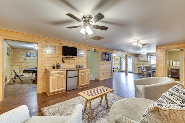433 Works Rd, Jackson, ME 04921 - living room featuring dark wood-type flooring, ceiling fan, and wooden walls