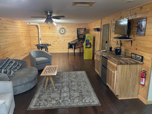 433 Works Rd, Jackson, ME 04921 - living room featuring wooden walls, ceiling fan, and dark hardwood / wood-style floors