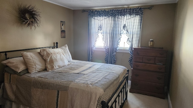 bedroom featuring carpet floors and crown molding