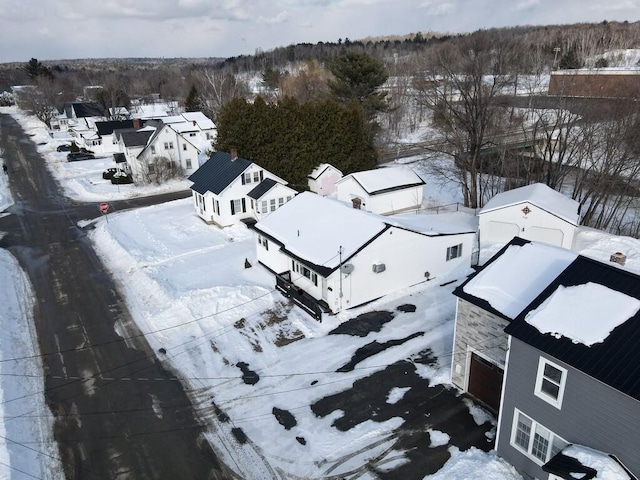 snowy aerial view featuring a residential view