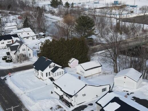 snowy aerial view featuring a residential view