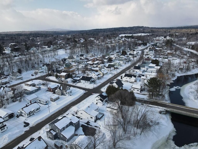 snowy aerial view with a residential view