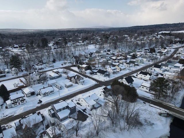 snowy aerial view featuring a residential view