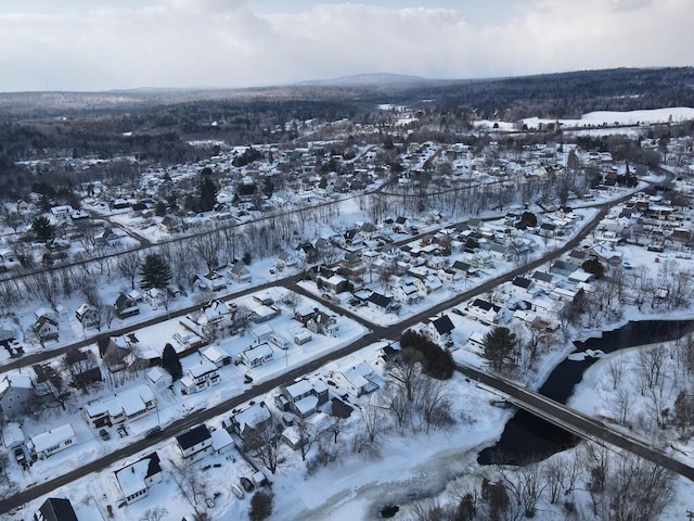 snowy aerial view with a residential view