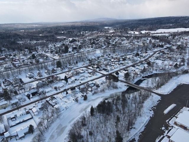 snowy aerial view featuring a residential view