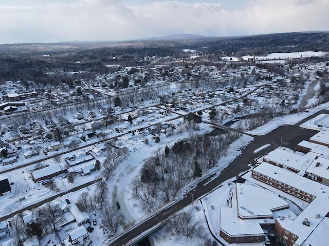 snowy aerial view with a residential view