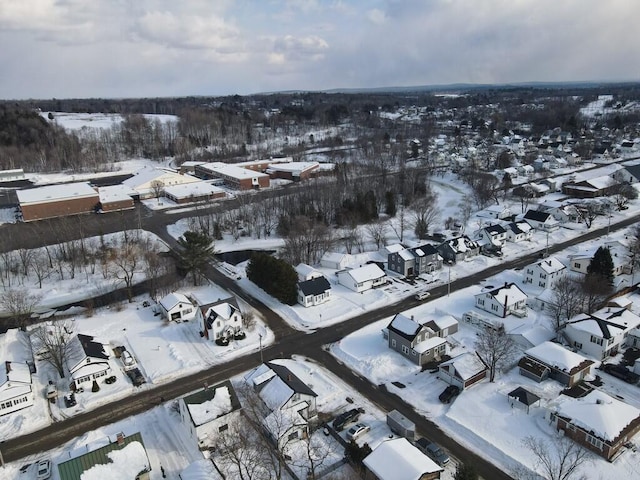 snowy aerial view featuring a residential view