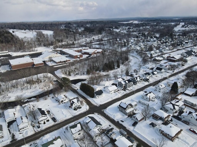 snowy aerial view featuring a residential view