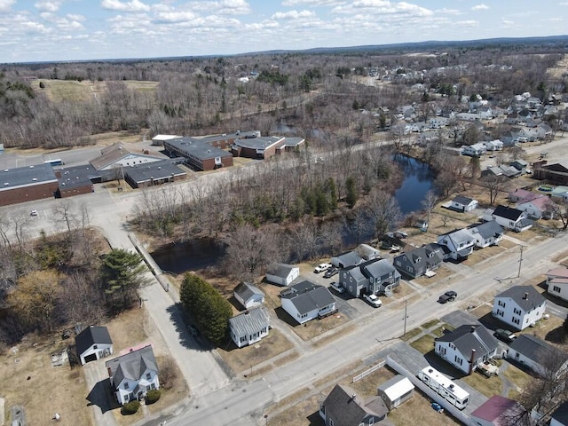 drone / aerial view with a residential view and a water view