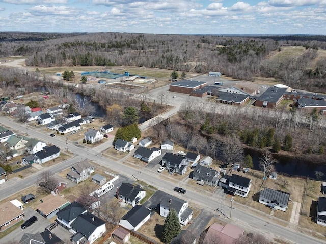 birds eye view of property with a wooded view