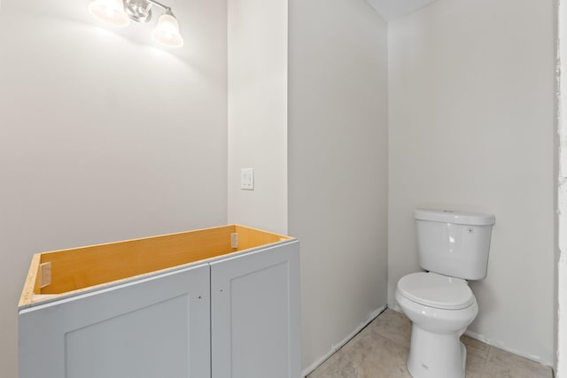 bathroom featuring tile patterned flooring and toilet