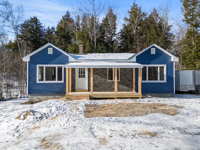 single story home with a porch