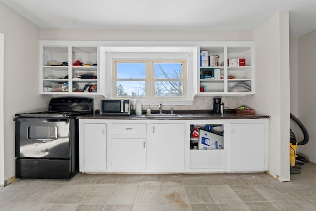 bar featuring white cabinetry, black / electric stove, and sink