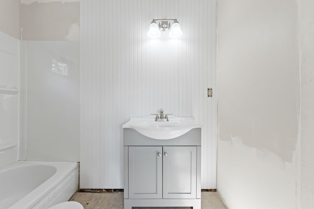 bathroom with wooden walls and vanity