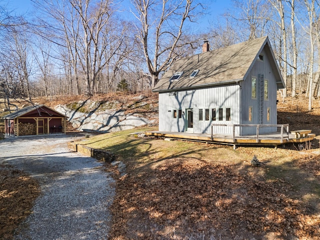 view of yard with a deck and a carport