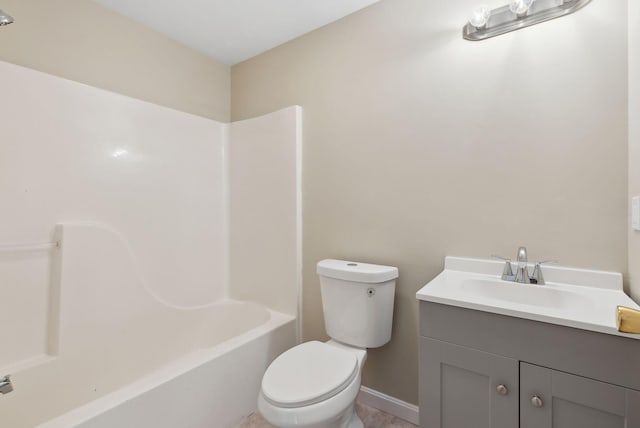 full bathroom featuring toilet, bathing tub / shower combination, and vanity