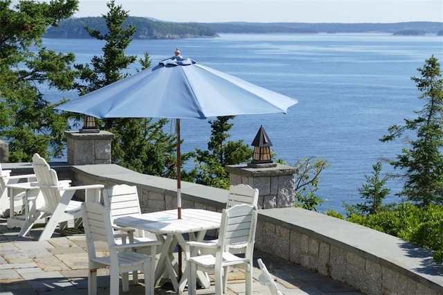 view of patio / terrace featuring a water view