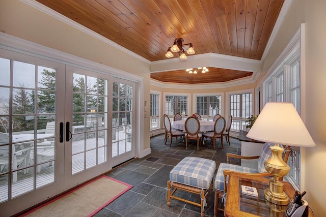 sunroom / solarium featuring a notable chandelier, wooden ceiling, and french doors