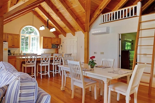 dining space with a notable chandelier, high vaulted ceiling, light wood-type flooring, and a wall unit AC