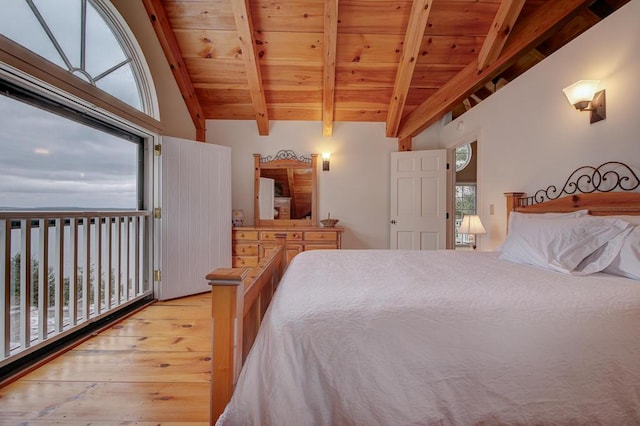 bedroom featuring lofted ceiling with beams, light hardwood / wood-style floors, and wooden ceiling