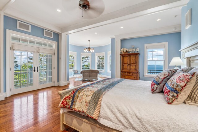 62 Sols Cliff Rd, Bar Harbor, ME 04609 - bedroom featuring access to outside, a chandelier, multiple windows, ornamental molding, and recessed lighting