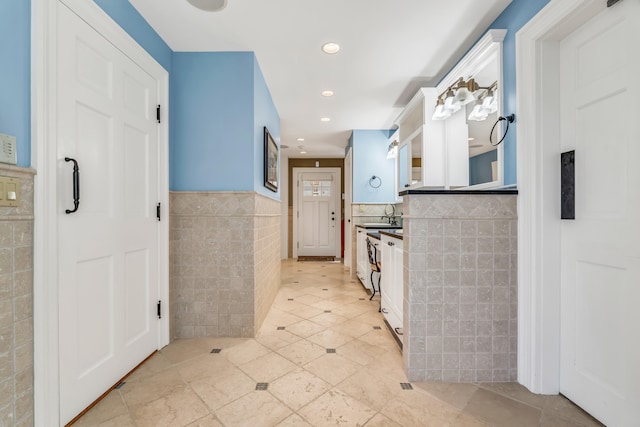 62 Sols Cliff Rd, Bar Harbor, ME 04609 - kitchen featuring tile walls, recessed lighting, light tile patterned flooring, and wainscoting