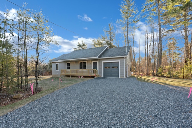 ranch-style house featuring a porch and a garage